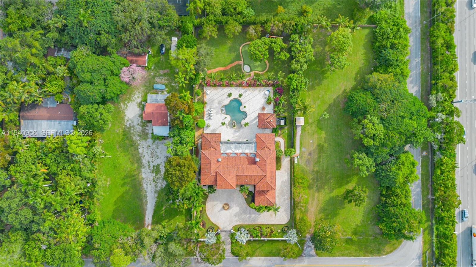 7538 Southwest 64th Street Miami, FL 33143 - Photo 76 of 78 an aerial view of residential house with outdoor space and trees all around