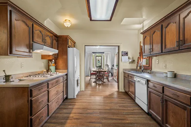 a bedroom with a large bed and glass door