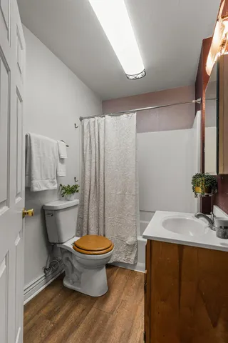 a view of a livingroom with furniture and a floor to ceiling window
