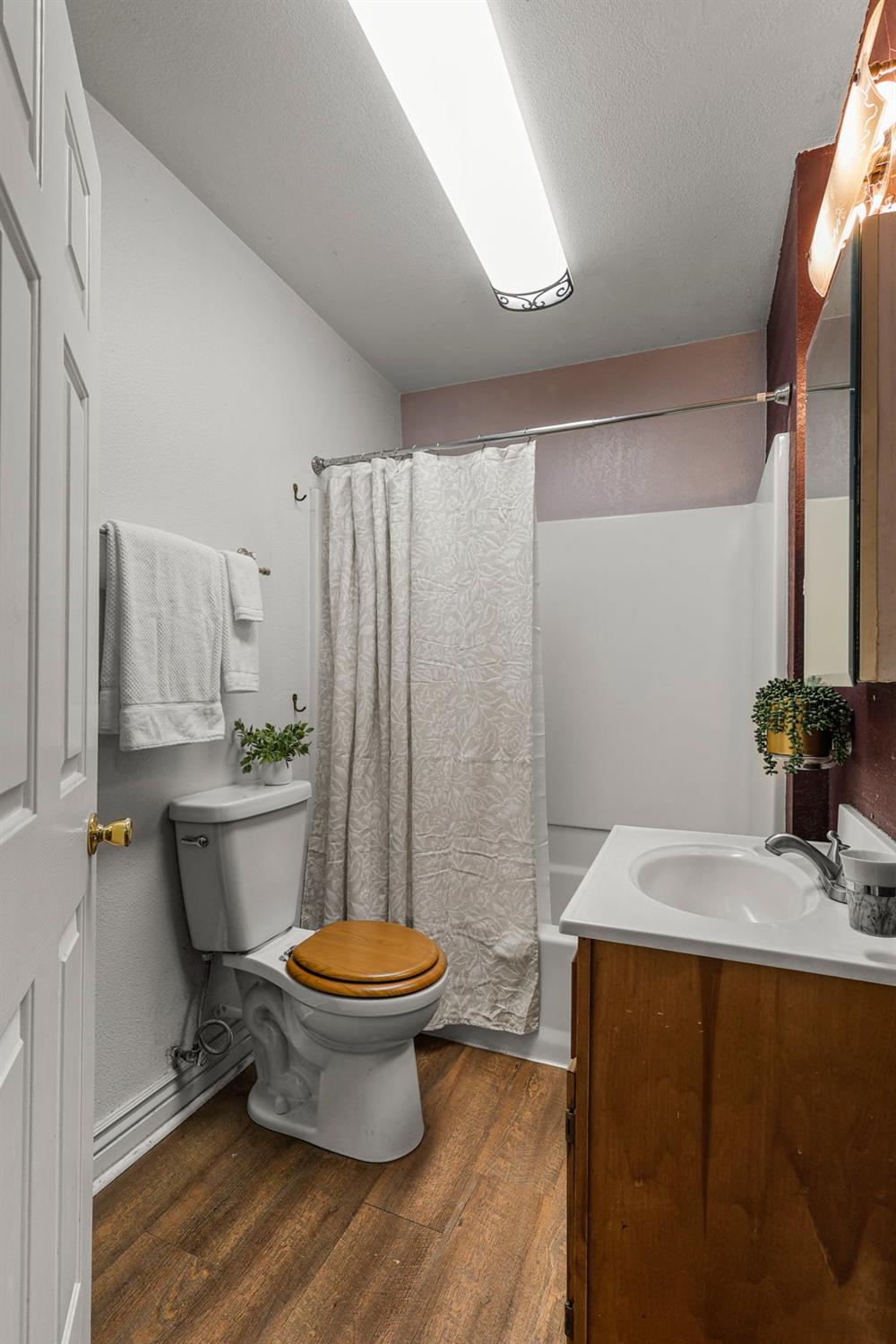 18525 Emerson Road Red Bluff, CA 96080 - Photo 21 of 92 a bathroom with a sink toilet and a mirror