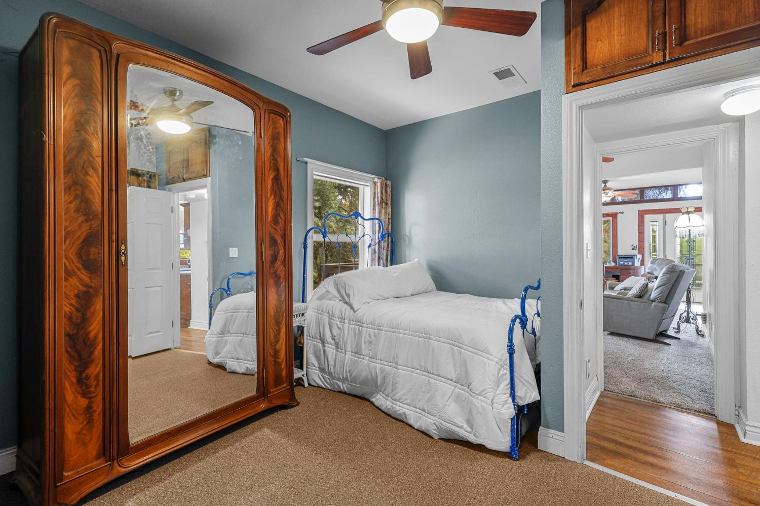 18525 Emerson Road Red Bluff, CA 96080 - Photo 23 of 92 a bedroom with a large bed and glass door