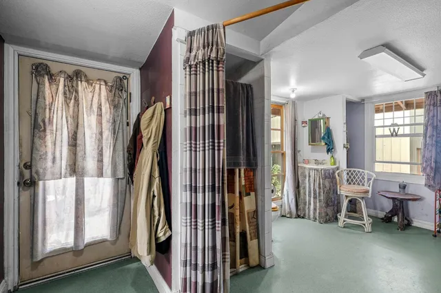 a view of living room with furniture and a window