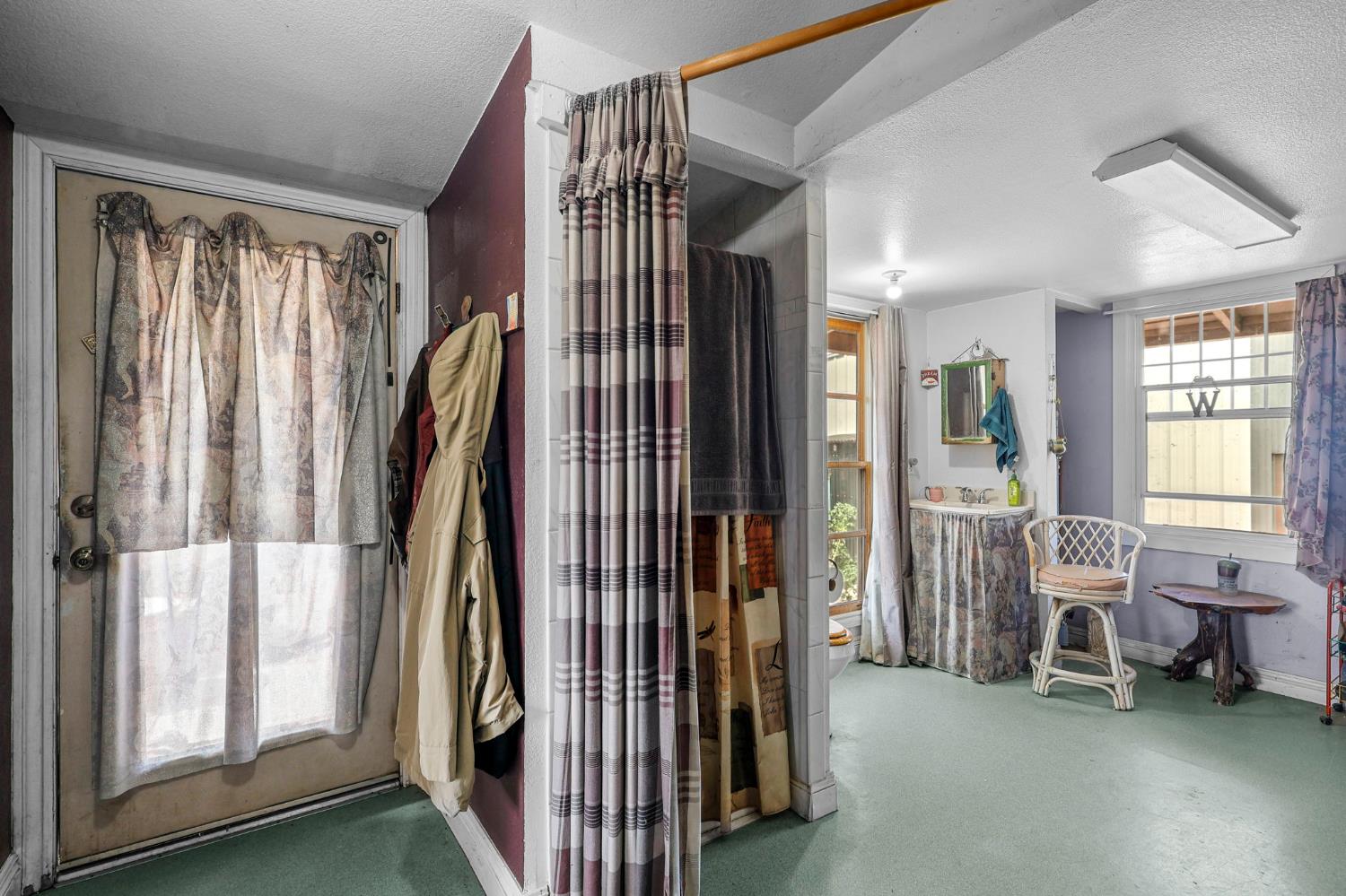 18525 Emerson Road Red Bluff, CA 96080 - Photo 28 of 92 a view of a bedroom with furniture and clothes