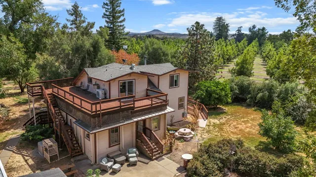 a bedroom with furniture and a flat screen tv