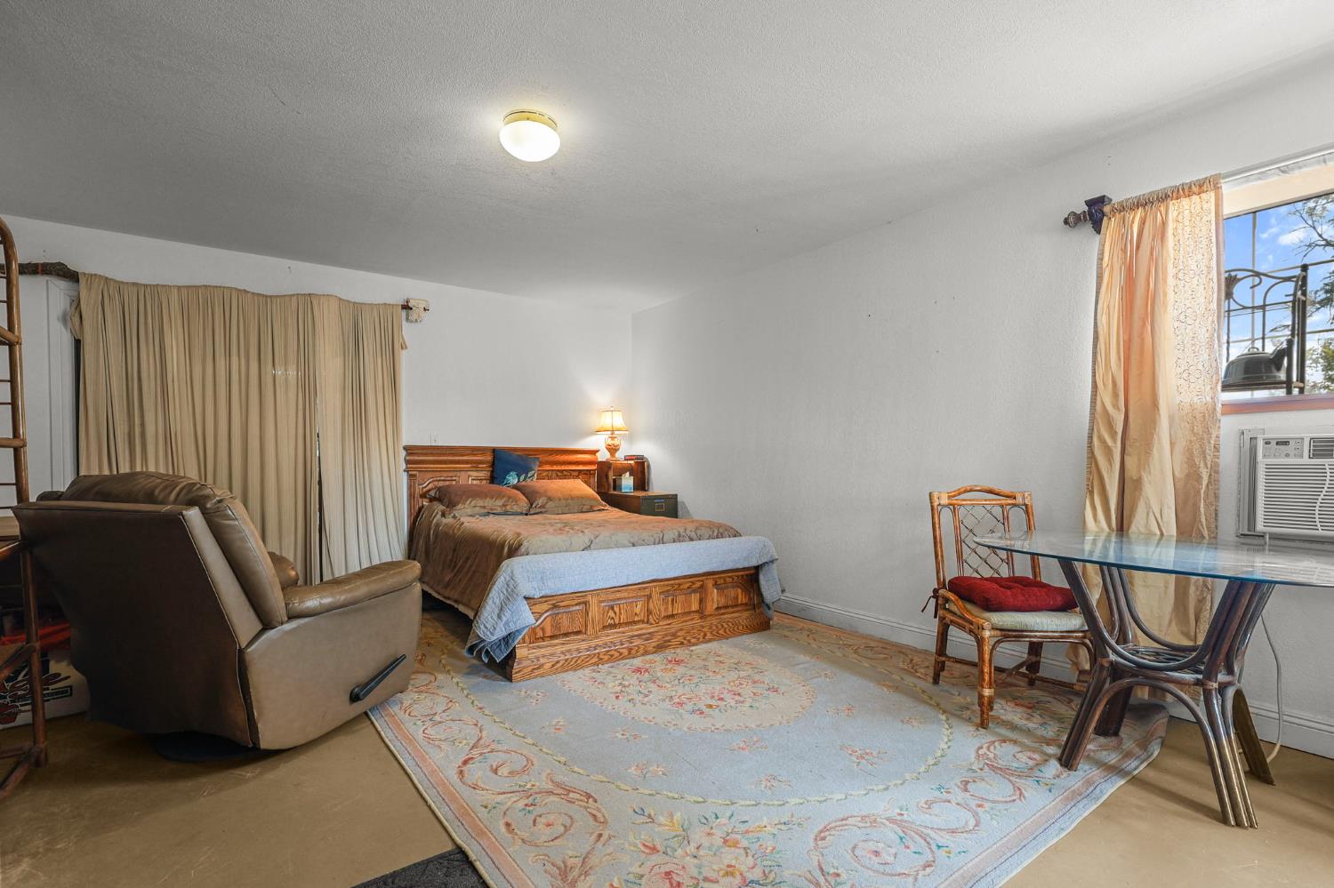 18525 Emerson Road Red Bluff, CA 96080 - Photo 89 of 92 a bedroom with a bed and wooden floor