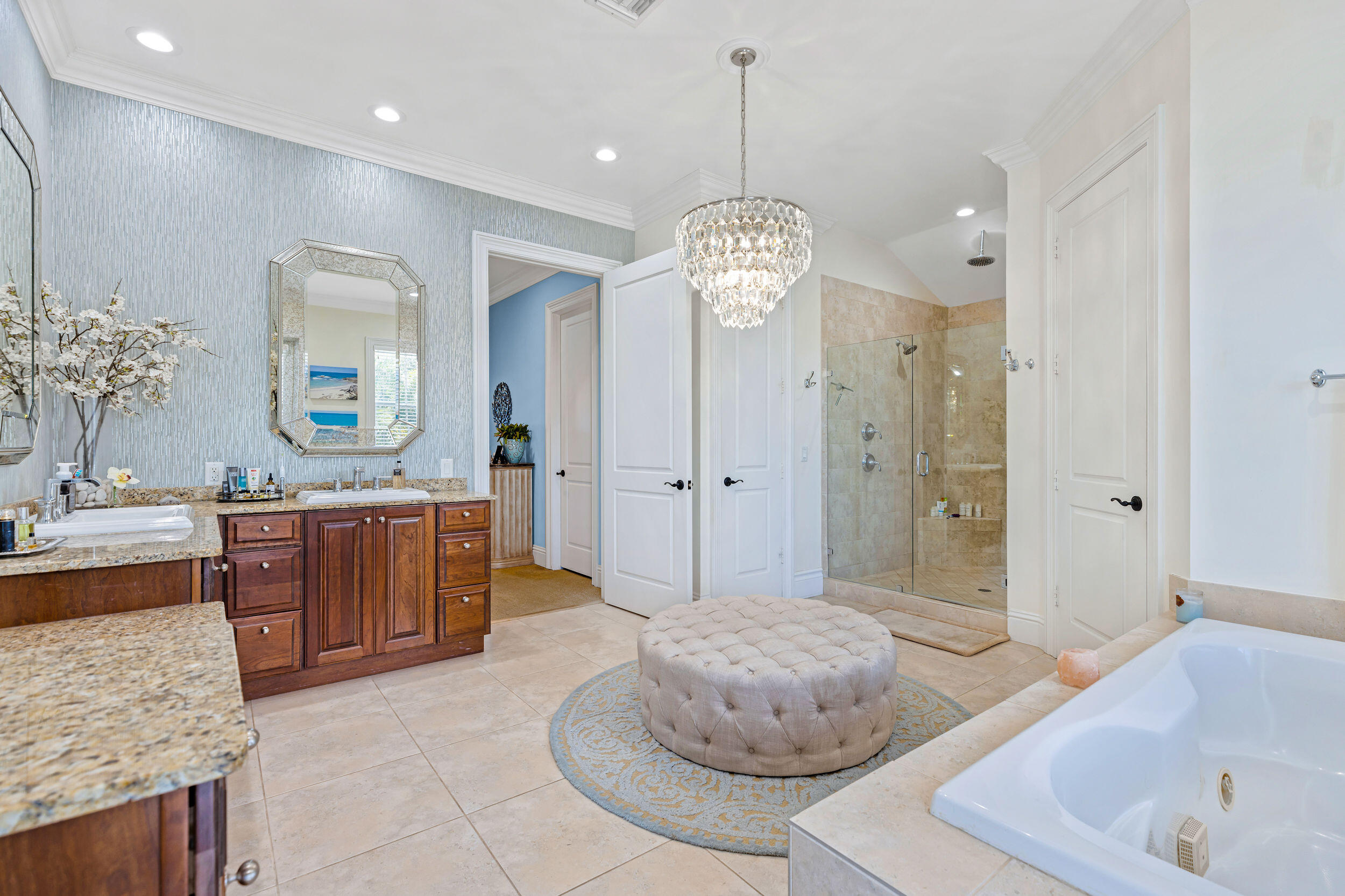 1310 Southwest 9th Avenue Boca Raton, FL 33486 - Photo 9 of 12 a spacious bathroom with a sink a large mirror and a bathtub