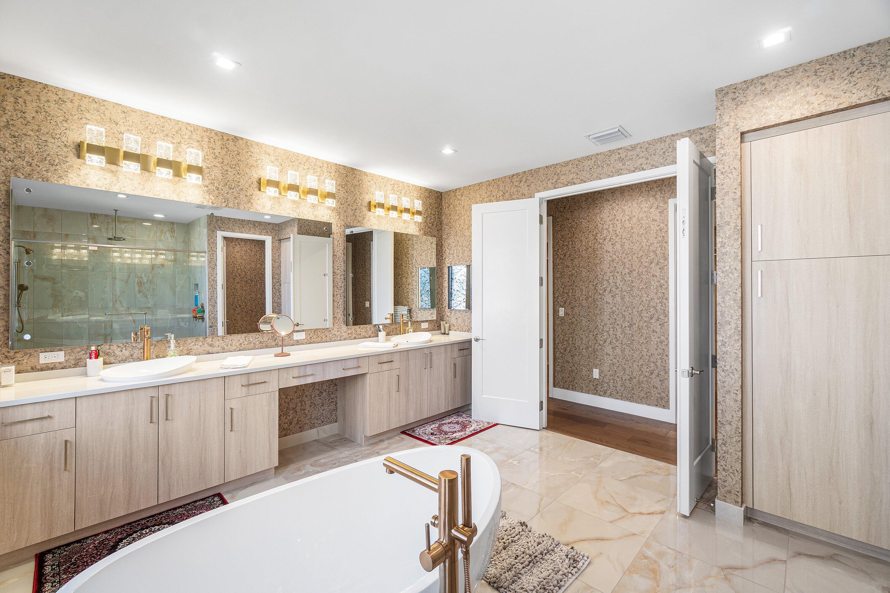 8233 Crystal Downs Avenue Boca Raton, FL 33434 - Photo 39 of 58 a large bathroom with a large tub and sink