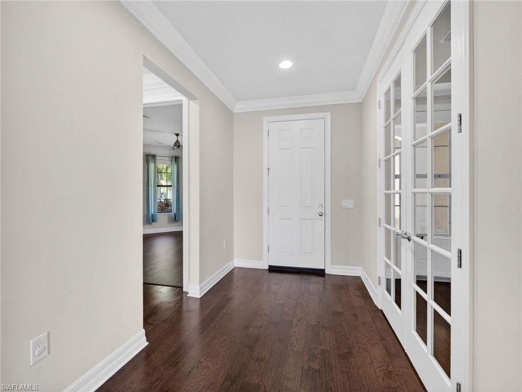 6124 Victory Drive Ave Maria, FL 34142 - Photo 25 of 50 wooden floor in an empty room with a window