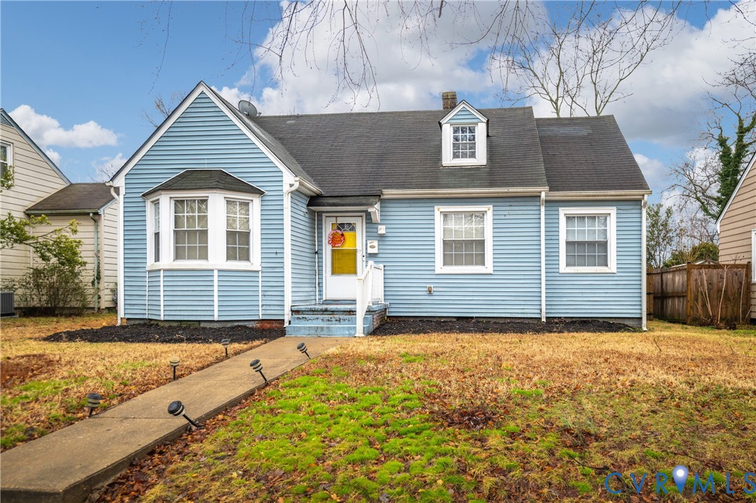 1311 Williamsburg Road Richmond, VA 23231 - Photo 2 of 38 Blue vinyl siding exterior with a dark shingle roo
