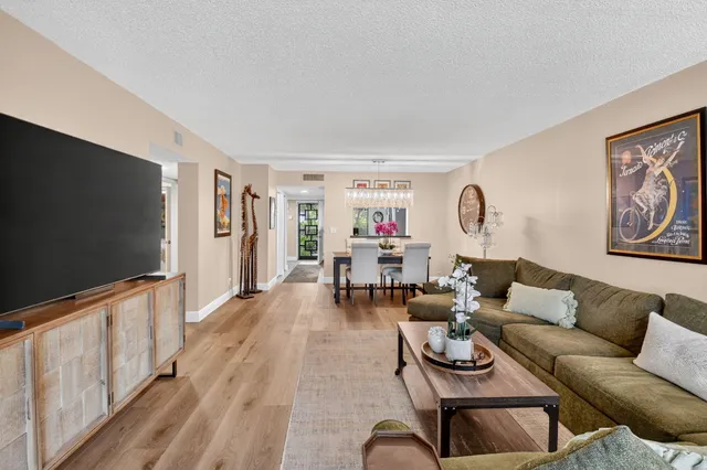 a spacious bedroom with a bed and a couch