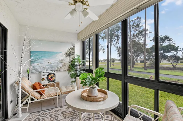 a swimming pool with lots of palm trees