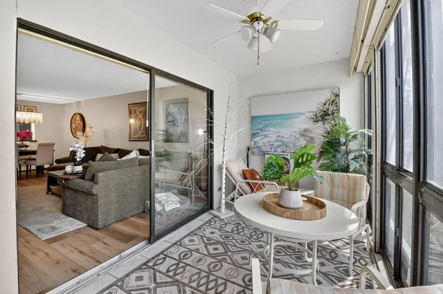 a aerial view of a house with a garden and lake view