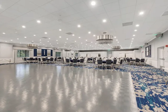 an aerial view of a house with outdoor space pool patio and lake view