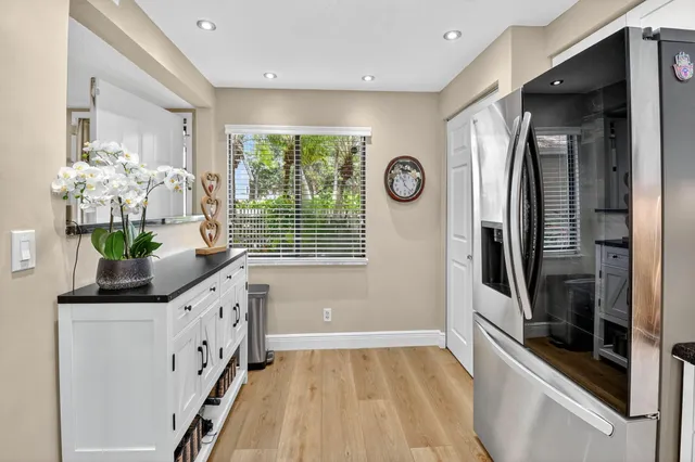 a kitchen with stainless steel appliances a refrigerator and a stove