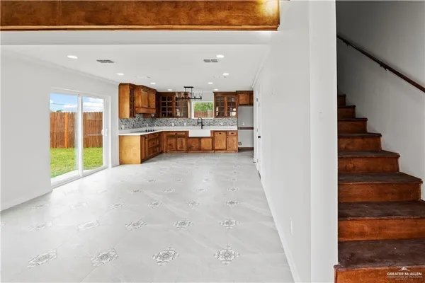 a view of kitchen and hall with wooden floor