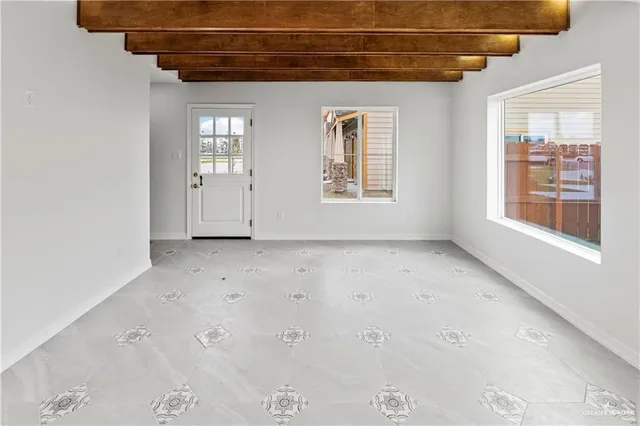 a view of a room with wooden walls and windows
