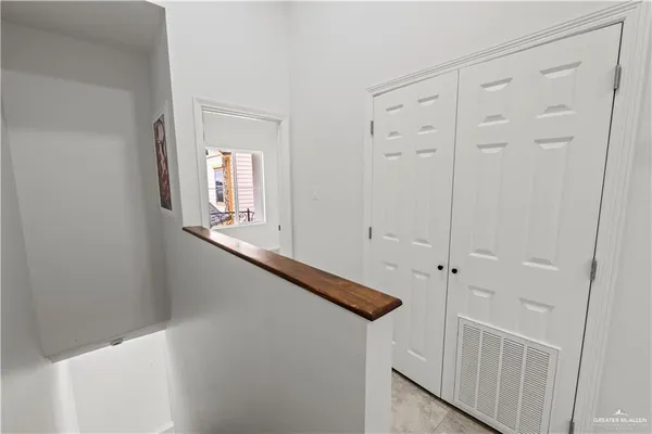 a view of an entryway with wooden floor