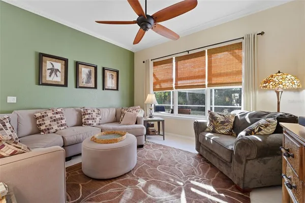 a kitchen with kitchen island a dining table chairs cabinets and stainless steel appliances
