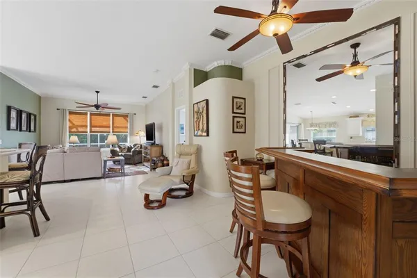 a very nice looking living room with a large window and furniture