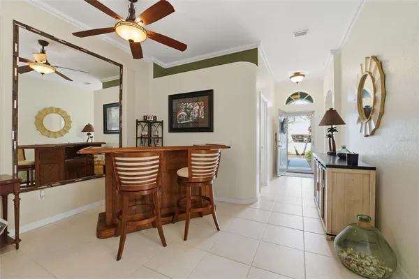 a dining room with furniture and a chandelier