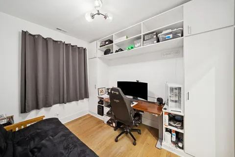 a workspace with furniture and wooden floor