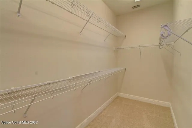 a view of a room with racks on the wall