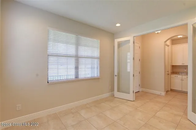 a view of an empty room with a window