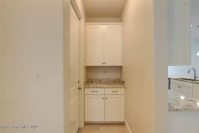 a view of cabinets and wooden floor