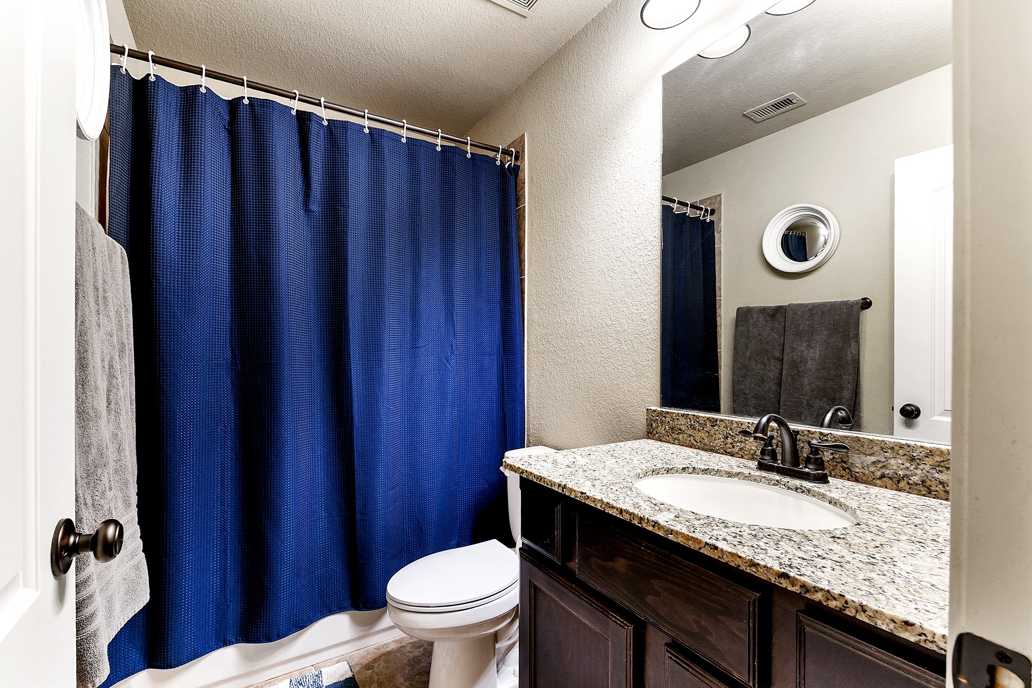 2939 Bobby Jones Road Katy, TX 77494 - Photo 37 of 50 a bathroom with a granite countertop sink and a mirror