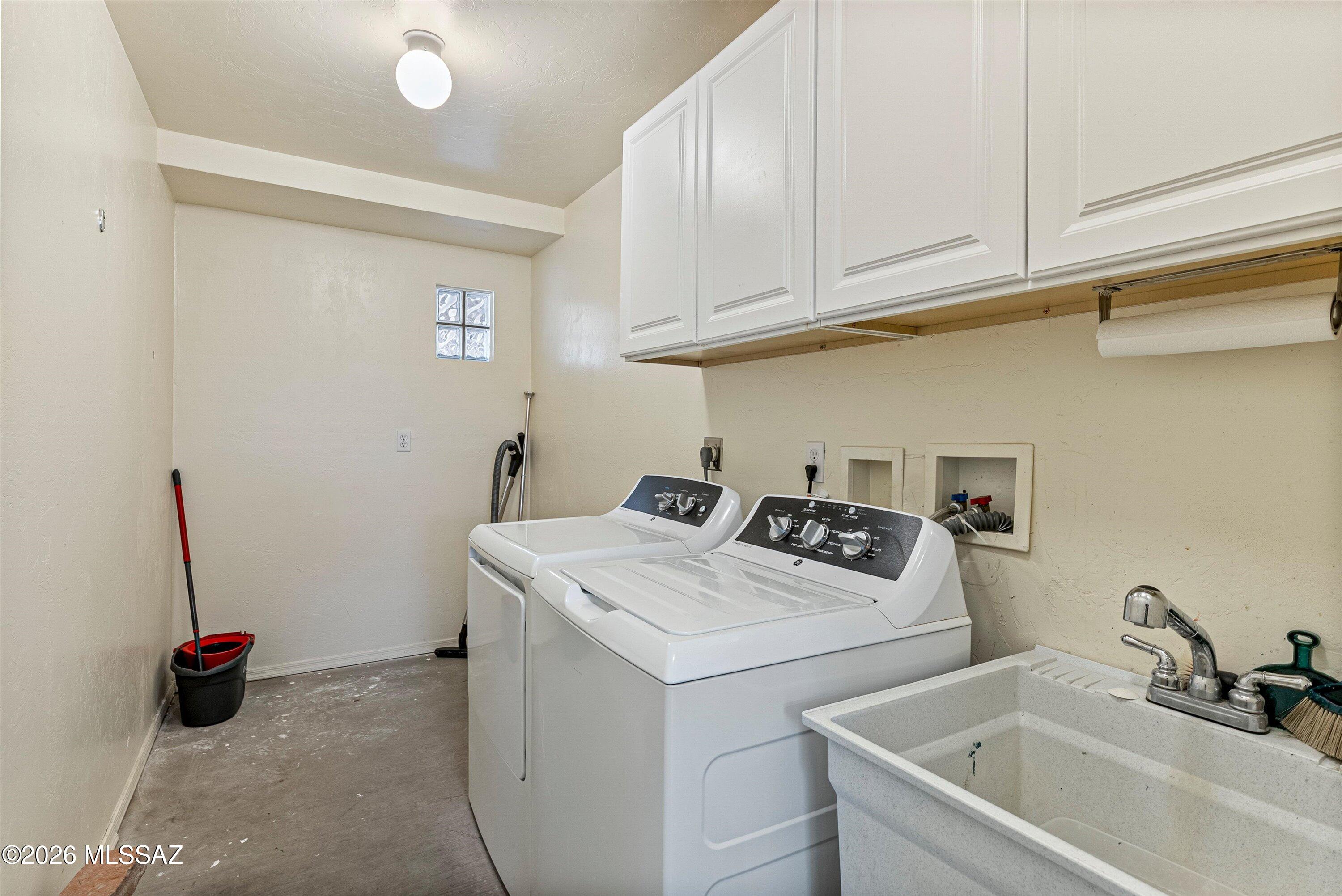 2107 East Lind Road Tucson, AZ 85719 - Photo 24 of 43 a utility room with sink dryer and washer