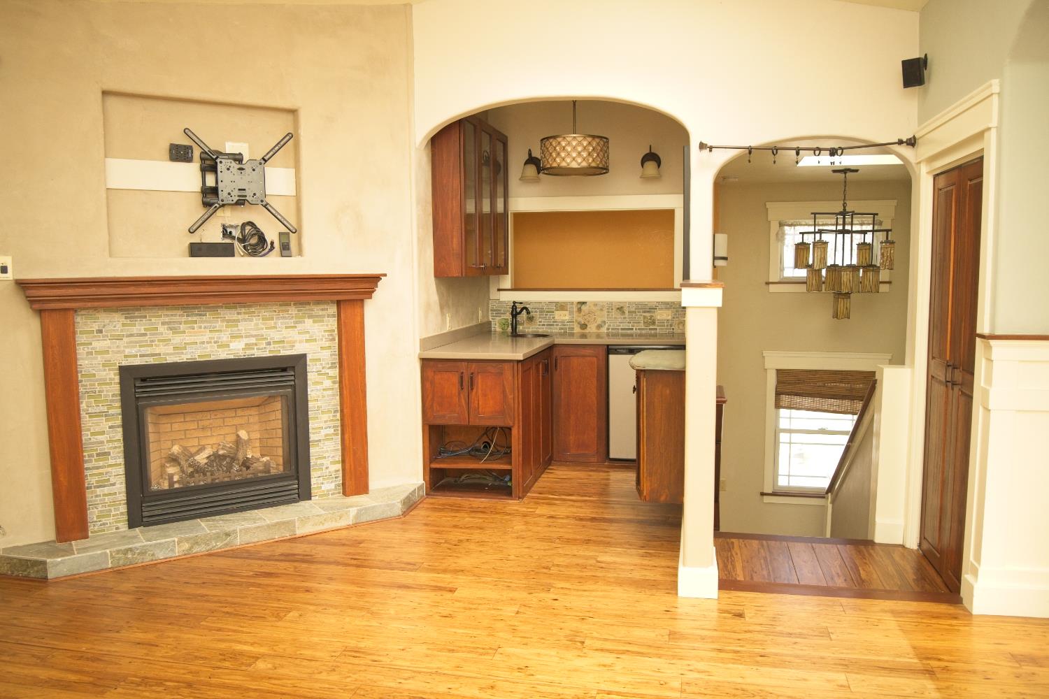 126 Center Street Jackson, CA 95642 - Photo 15 of 95 Gas fireplace and wetbar off main/street level living room. Stairs off side/deck entry down to kitchen, dining and family room.