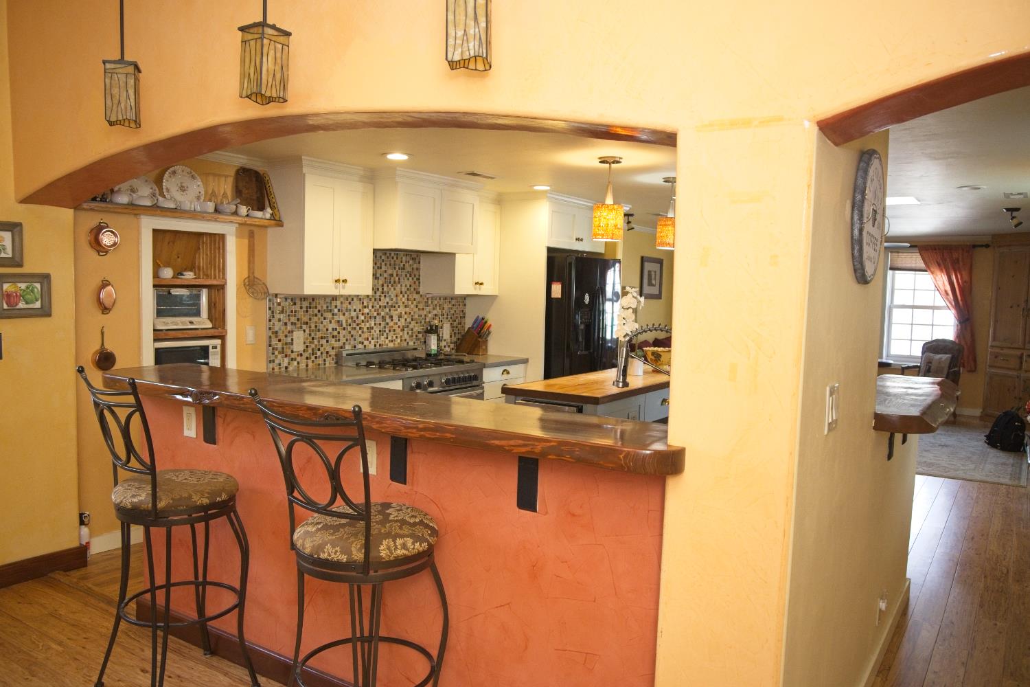 126 Center Street Jackson, CA 95642 - Photo 27 of 95 Dining bar opposite of dining area/built in bench seating and custom cabinetry