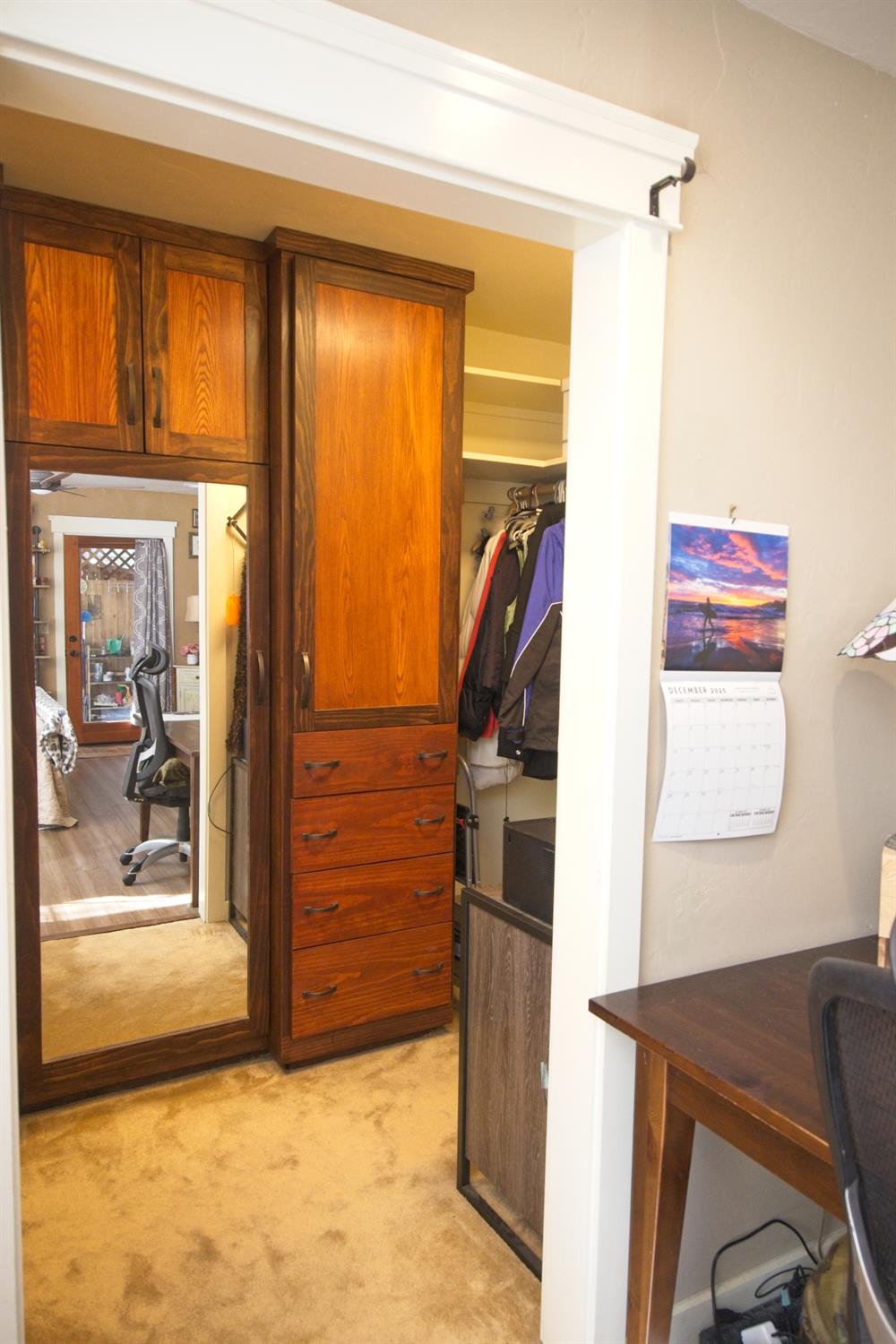 126 Center Street Jackson, CA 95642 - Photo 46 of 95 Spacious walk in closet with custom built ins, mirrored face, ample hanging and storage shelving