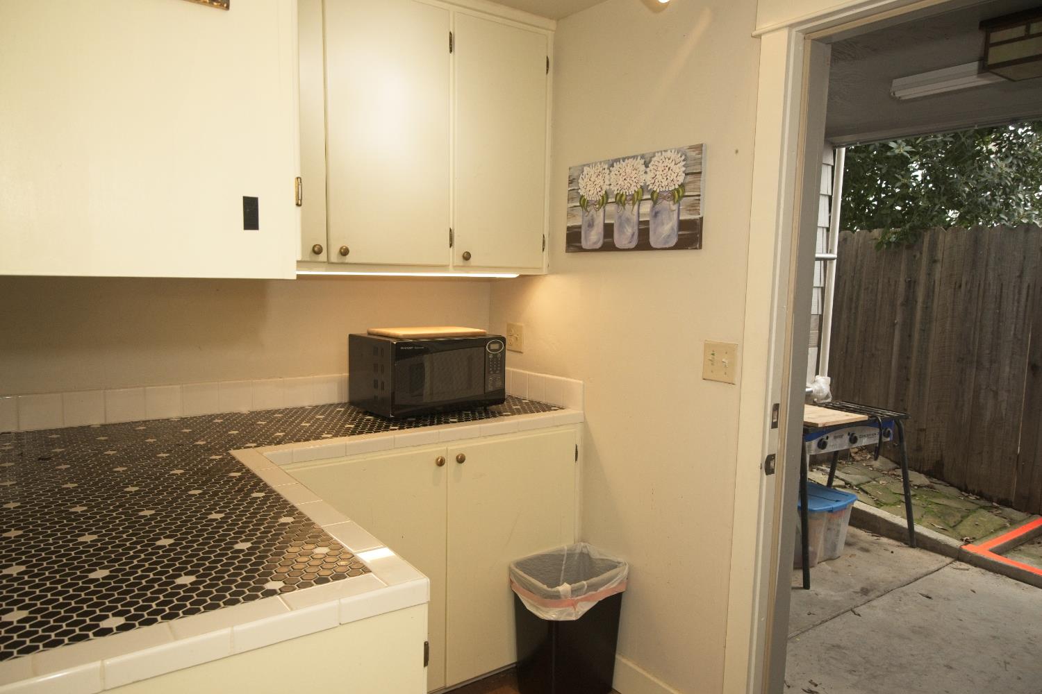 126 Center Street Jackson, CA 95642 - Photo 63 of 95 Lower level dry bar/storage adjacent to laundry/garage access with exterior access to outdoor kitchen including commercial stainless steel sink!
