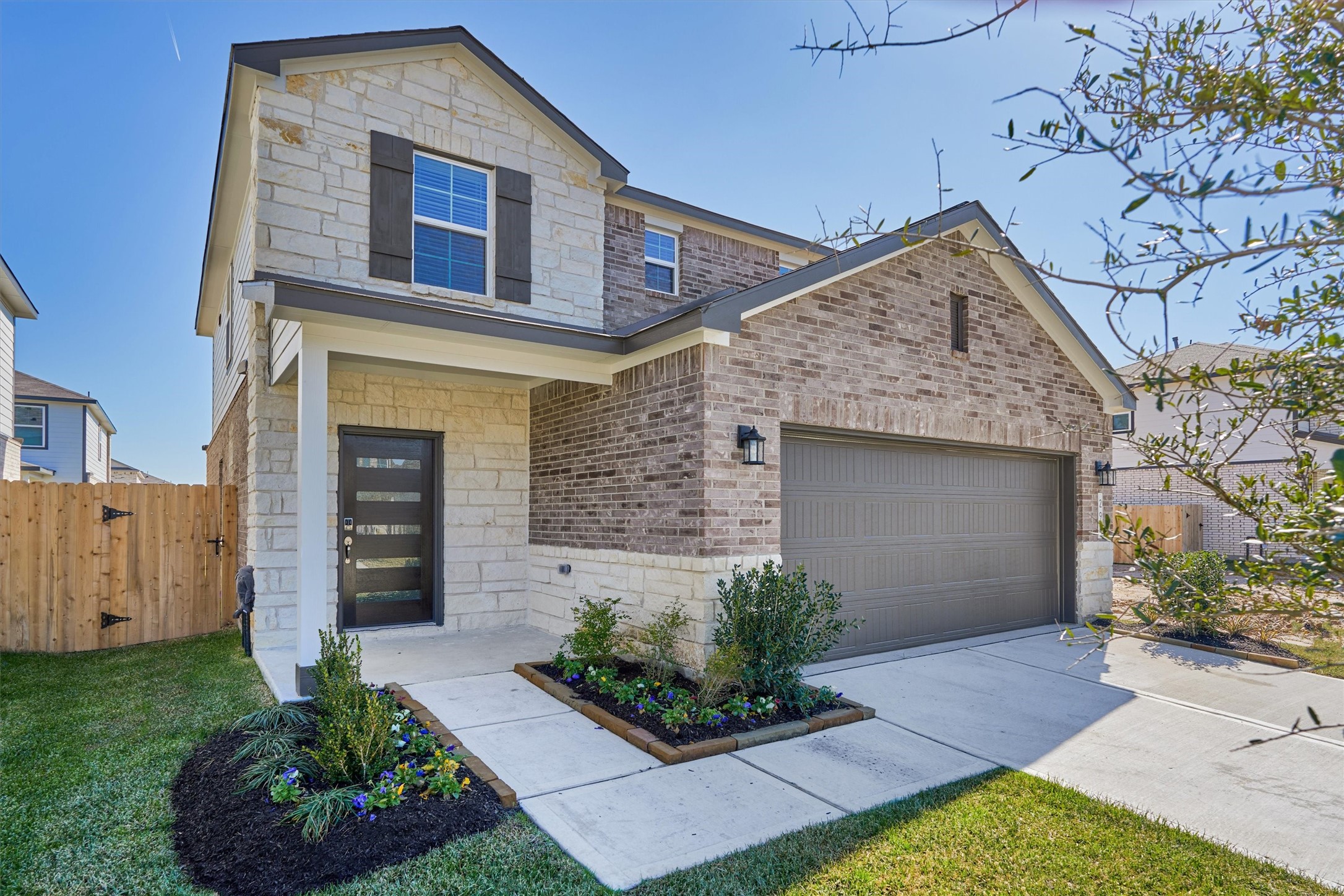294 Brazen Forest Trail Magnolia, TX 77354 - Photo 2 of 37 a front view of a house with a garden