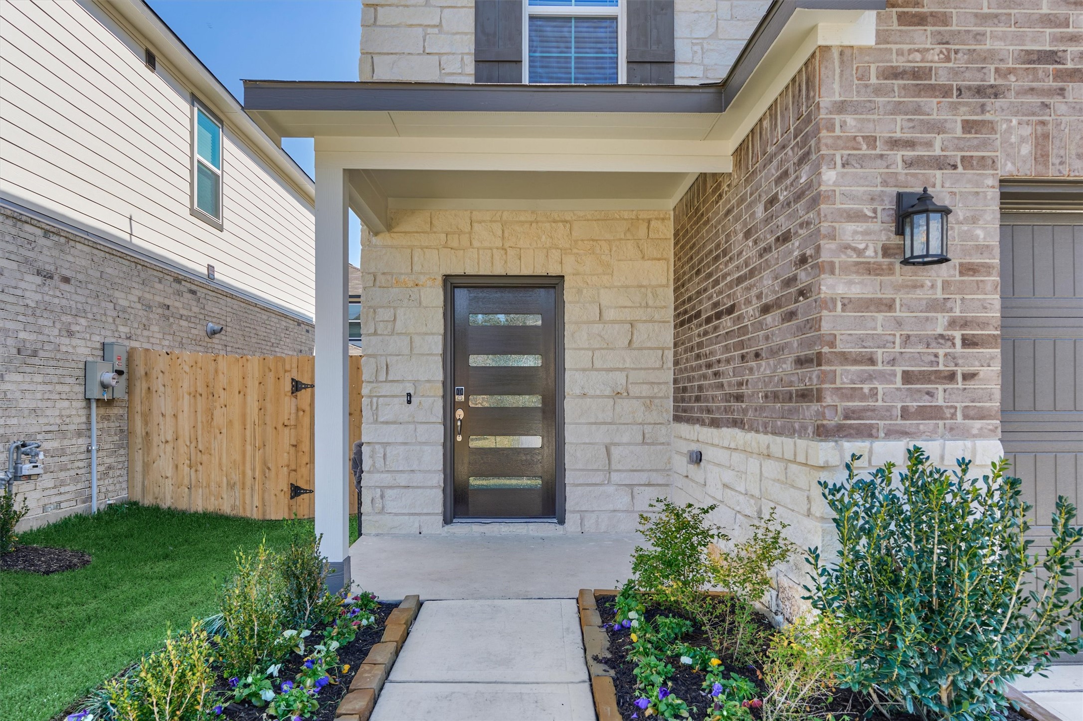 294 Brazen Forest Trail Magnolia, TX 77354 - Photo 3 of 37 a front view of a house with a garden