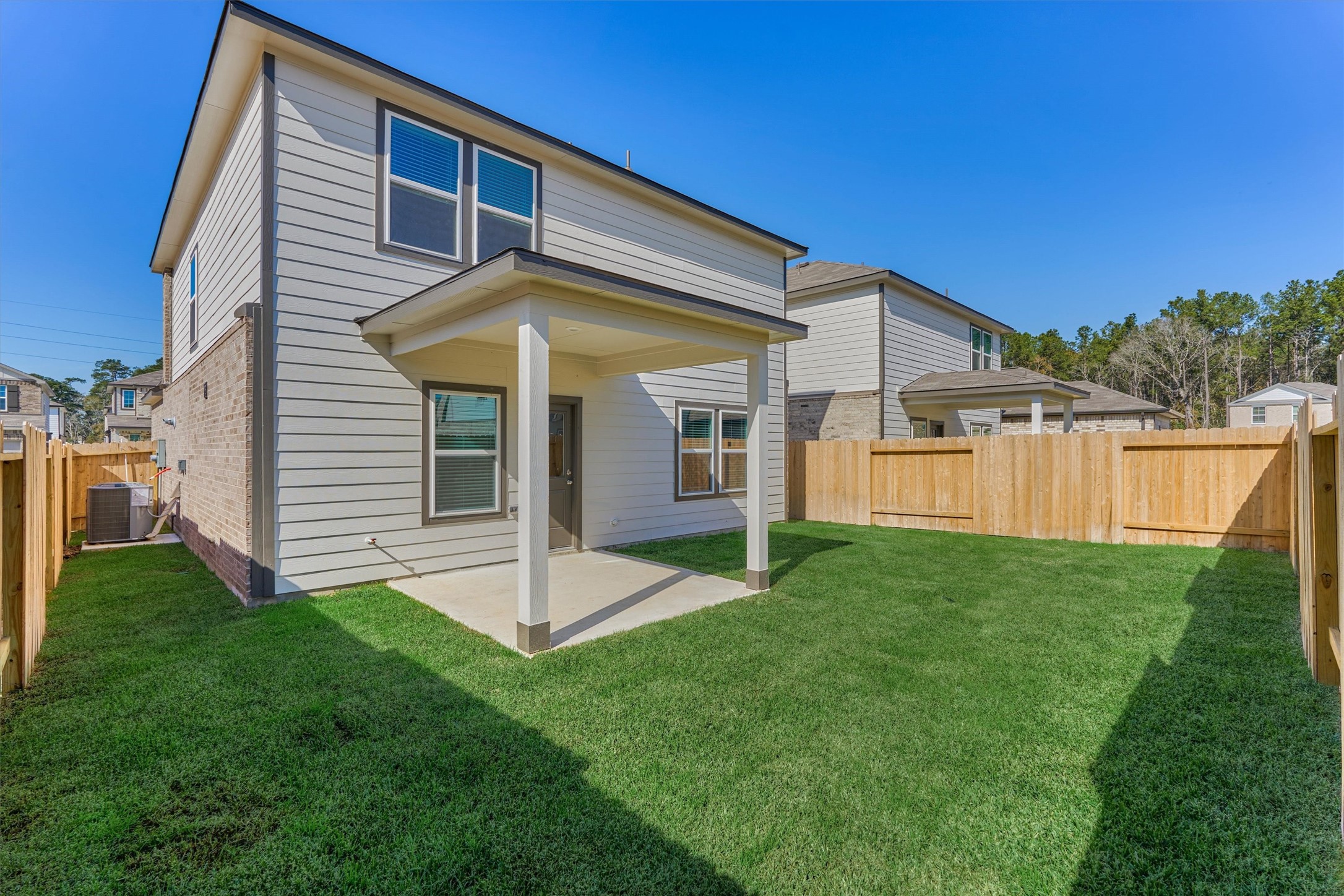 294 Brazen Forest Trail Magnolia, TX 77354 - Photo 35 of 37 a view of a house with a yard