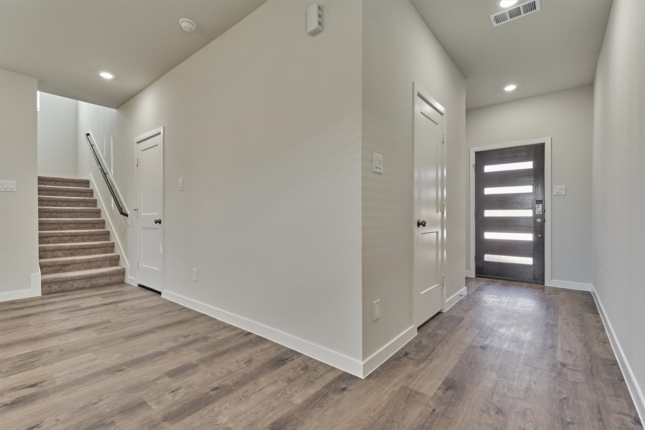 294 Brazen Forest Trail Magnolia, TX 77354 - Photo 6 of 37 a view of a hallway with wooden floor and entryway