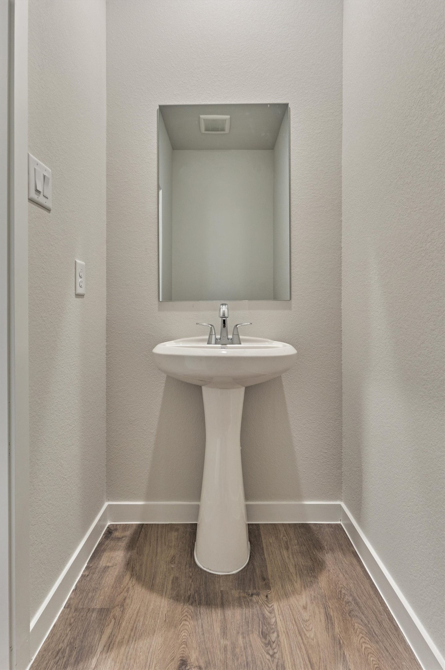 294 Brazen Forest Trail Magnolia, TX 77354 - Photo 7 of 37 a bathroom with a sink a mirror and wooden floor