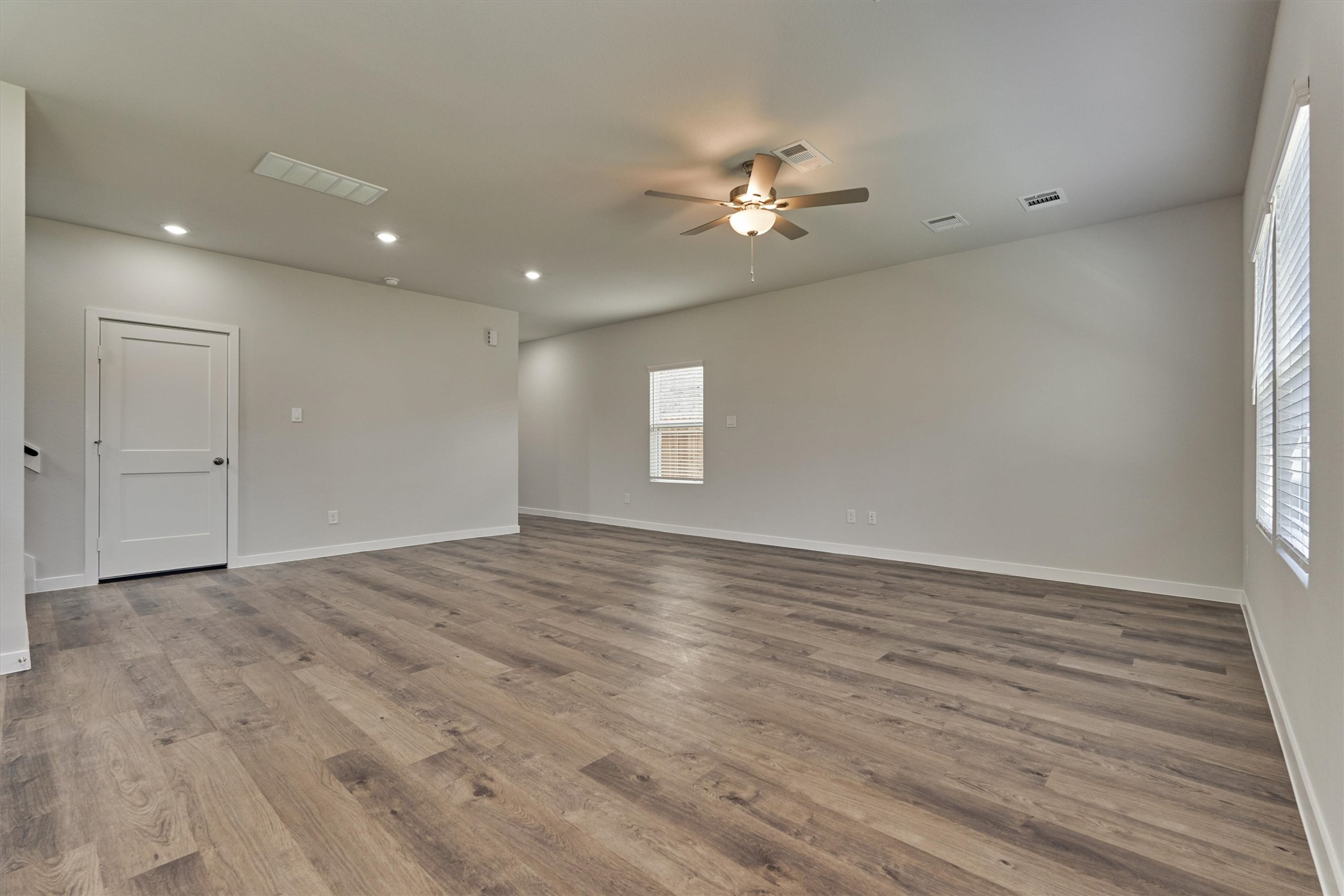 294 Brazen Forest Trail Magnolia, TX 77354 - Photo 10 of 37 a view of empty room with wooden floor and fan