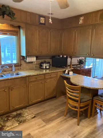 a bathroom with a sink a mirror and a bathtub
