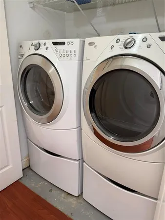 a utility room with dryer and washer