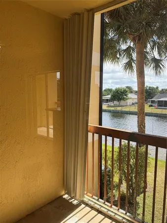 a view of a balcony with a tree