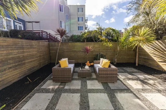 a view of a lake with couches and city view
