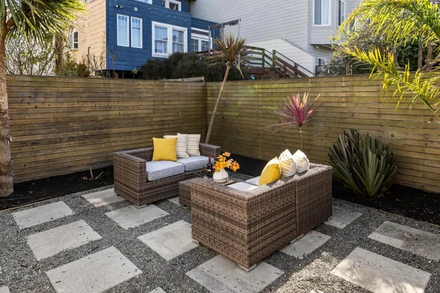 a view of a wooden chairs on the deck
