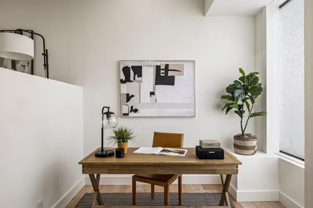 a view of a workspace with furniture
