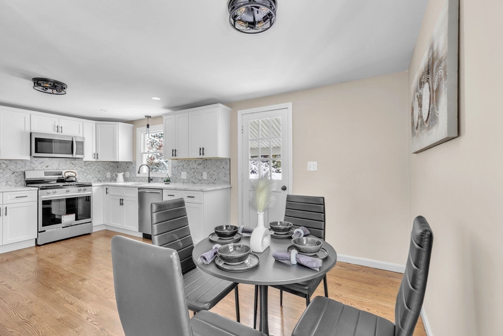 9 Edwill Road East Longmeadow, MA 01028 - Photo 13 of 34 a view of a dining room with furniture and wooden floor