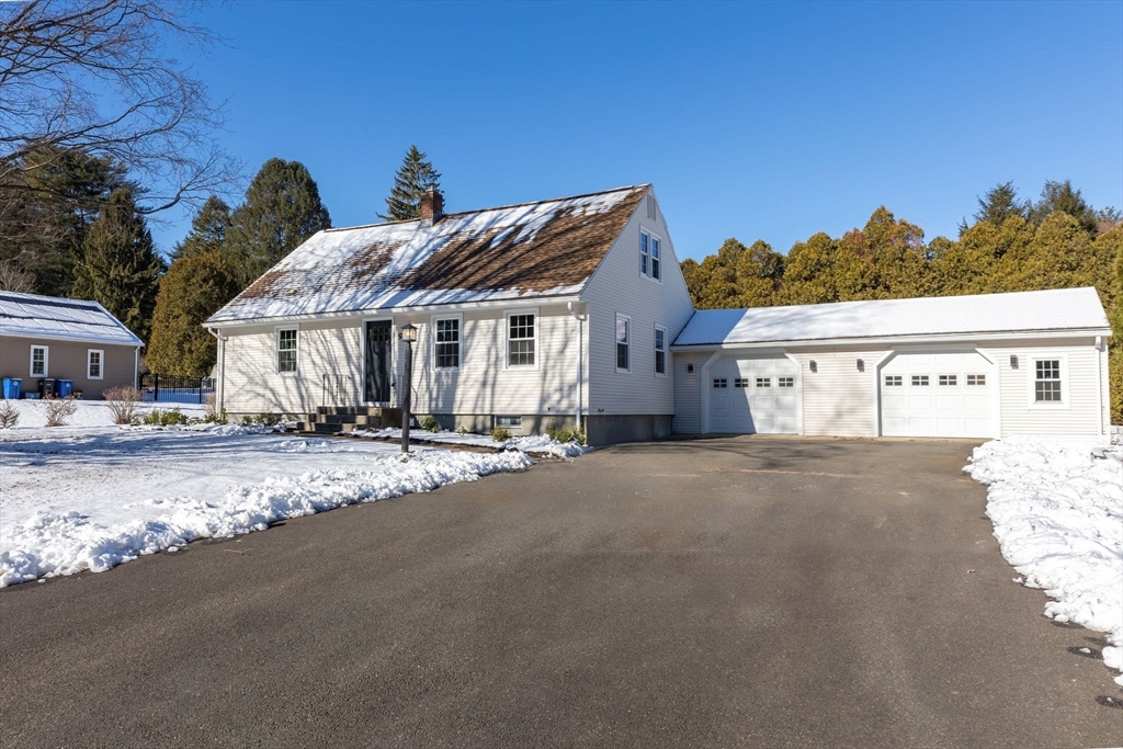 9 Edwill Road East Longmeadow, MA 01028 - Photo 2 of 34 a front view of a house with a yard and garage