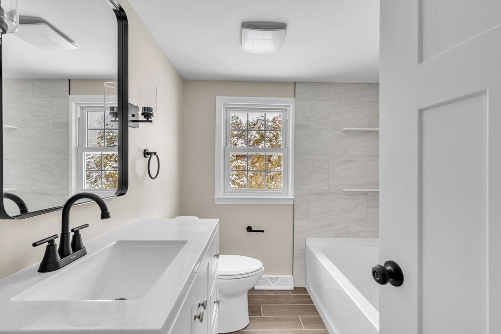 9 Edwill Road East Longmeadow, MA 01028 - Photo 27 of 34 a bathroom with a sink a toilet and shower