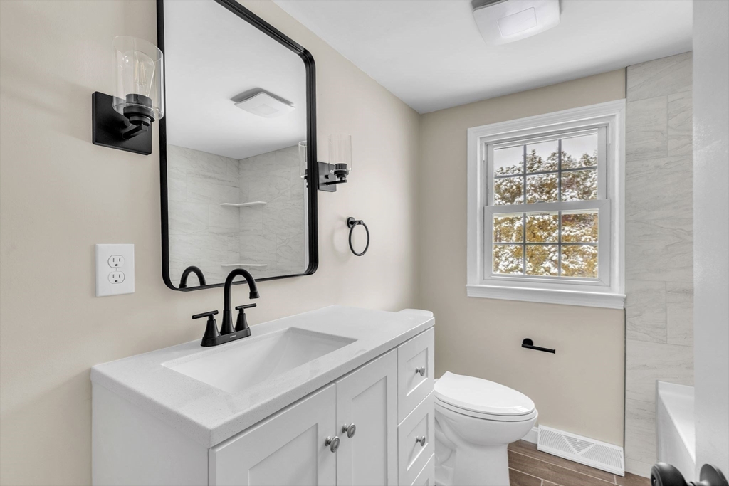 9 Edwill Road East Longmeadow, MA 01028 - Photo 28 of 34 a bathroom with a toilet sink and mirror